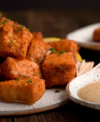 Air Fryer Spicy Salmon Bites with Avocado Lime Sauce