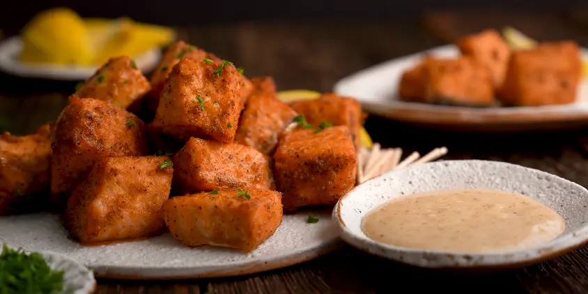 Air Fryer Spicy Salmon Bites with Avocado Lime Sauce